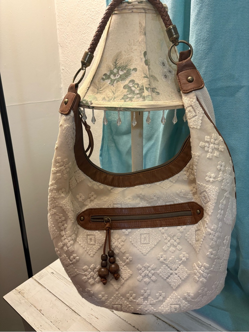Cream Embroidered Hobo Shoulder Bag with Brown Trim t shirt and jeans